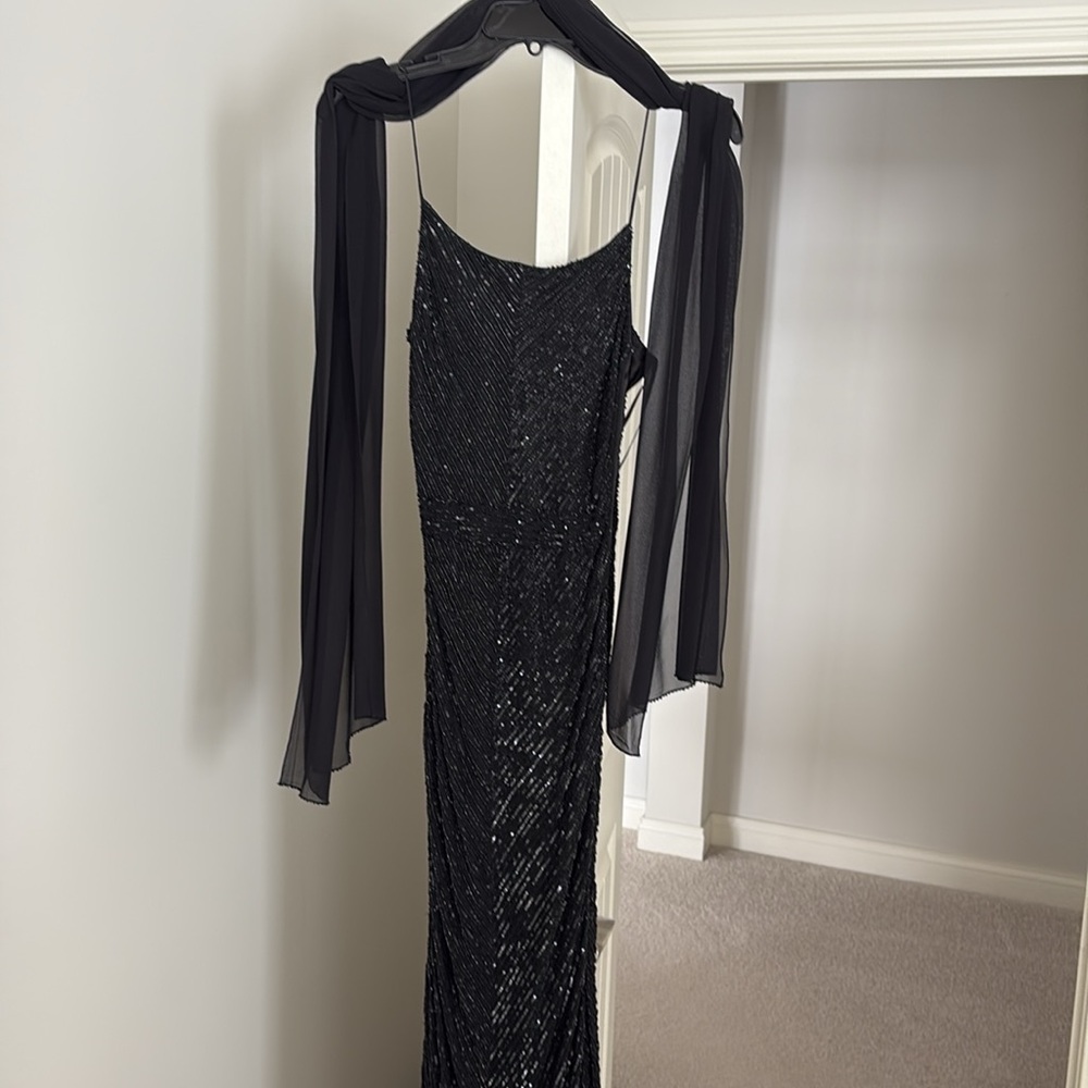 Long fully beaded black evening gown.